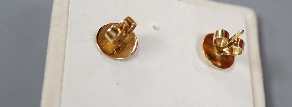 A modern pair of yellow metal, cultured pearl and diamond set scroll drop drop earrings, overall 34mm, gross weight 10.3 grams.